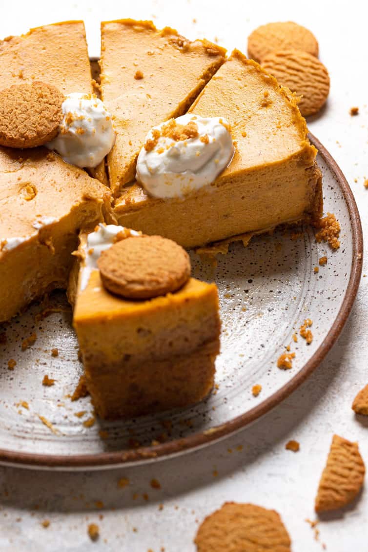 Slices of pumpkin cheesecake on the base of springform pan.