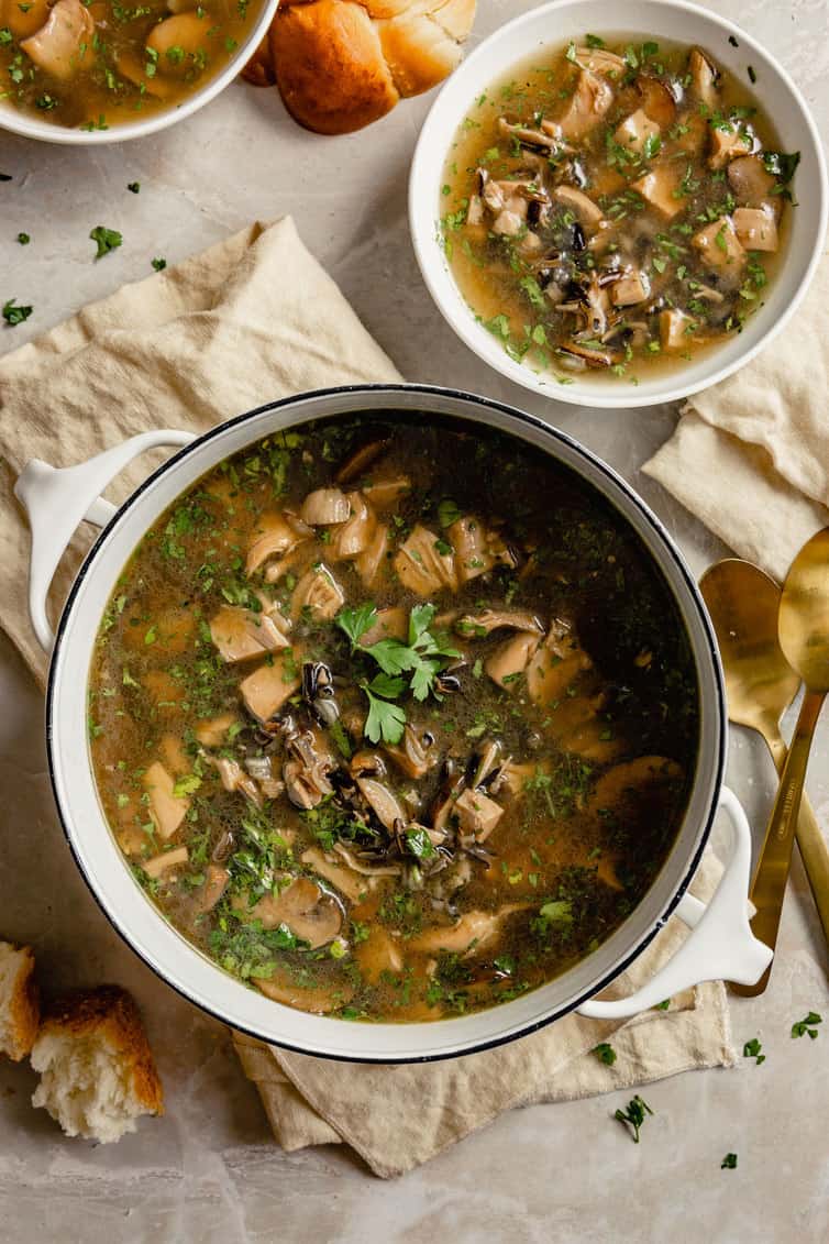 Overhead photo of pot of soup with smaller bowl in background.