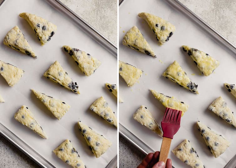 Side by side photo on the left the buttermilk scones with blueberries are brushed with an egg wash topping and on the right the scones are being brushed with a pastry brush on a baking sheet.