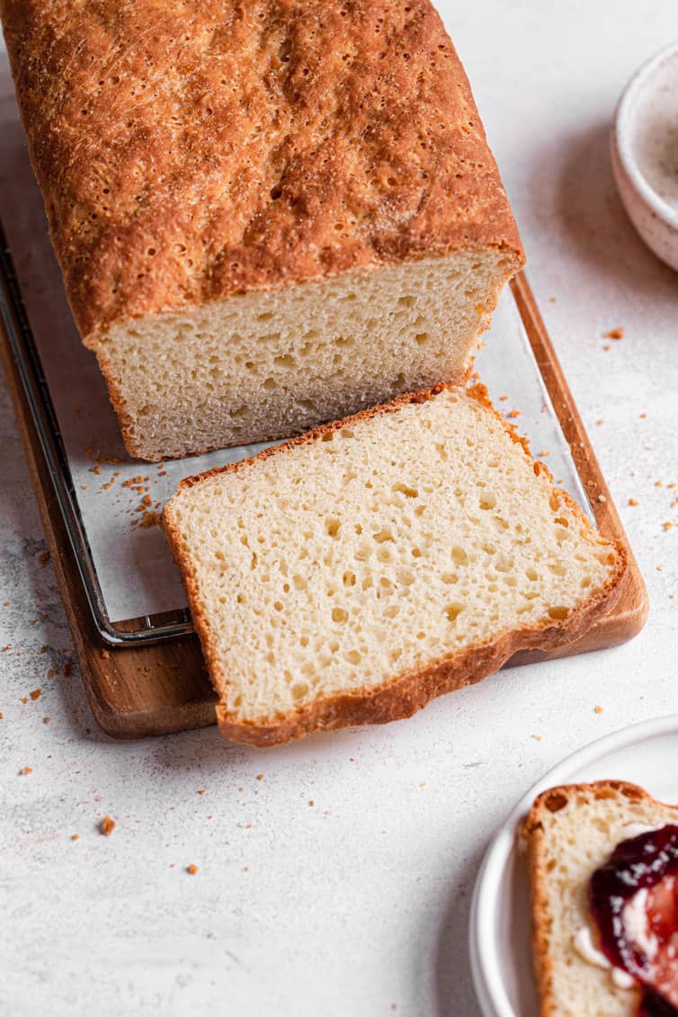 Sliced English muffin bread on a cutting board.