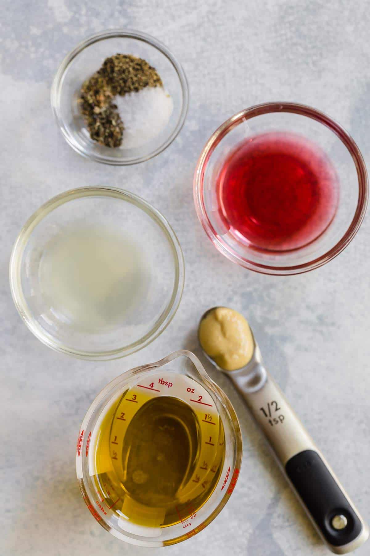 Ingredients for homemade Italian dressing prepped on the counter.