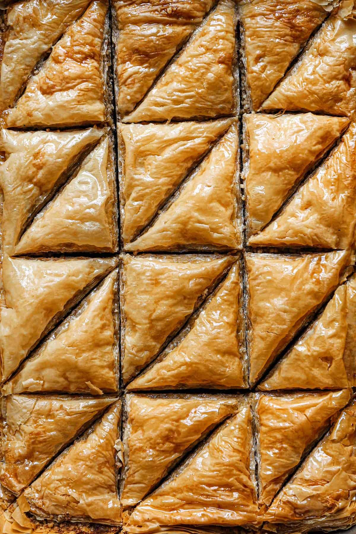 Top down photo of baklava cut into triangles.