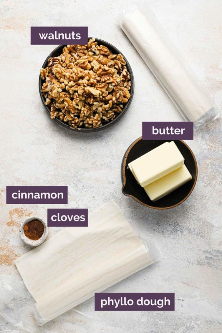 Baklava ingredients on a counter with labels for each ingredient.