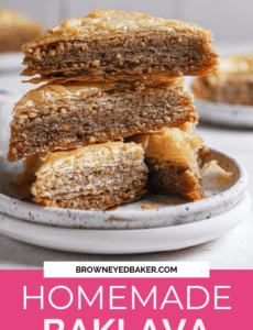 A stack of baklava slices on a white plate with the words homemade baklava at the bottom in a pink rectangle.