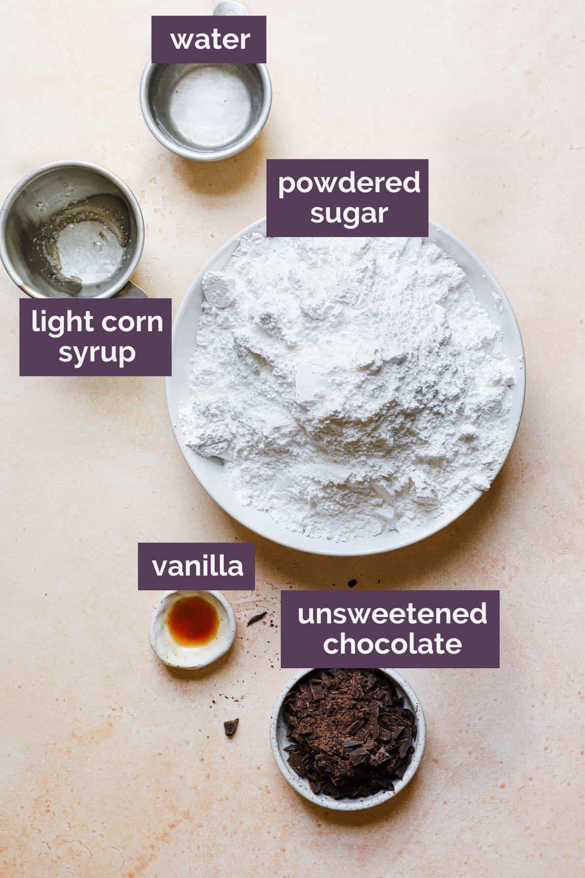 Ingredients for black and white cookie icing with purple labels saying what each ingredient is.
