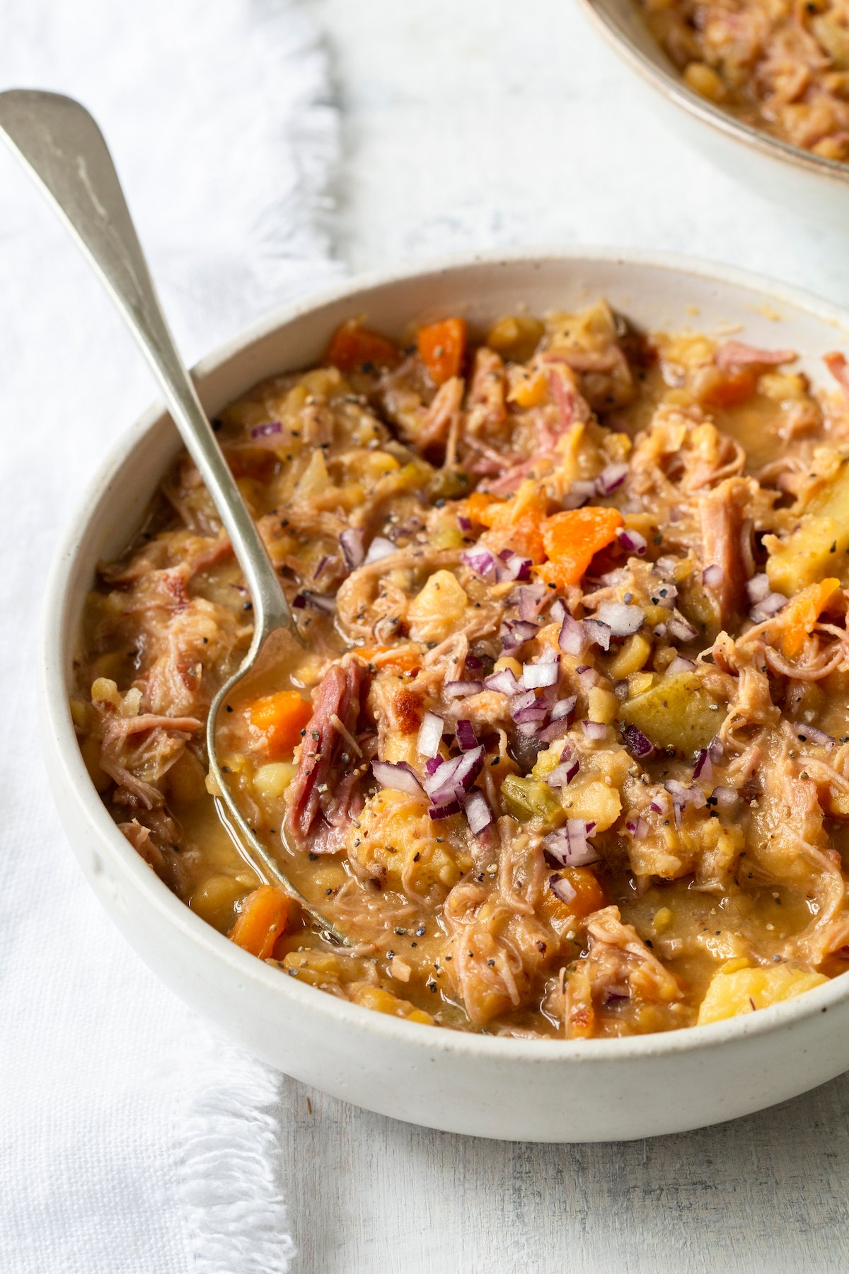 Ham and Split Pea Soup in bowl with spoon