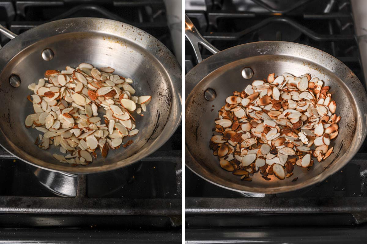 Sliced almonds being toasted in a stainless steel skillet.