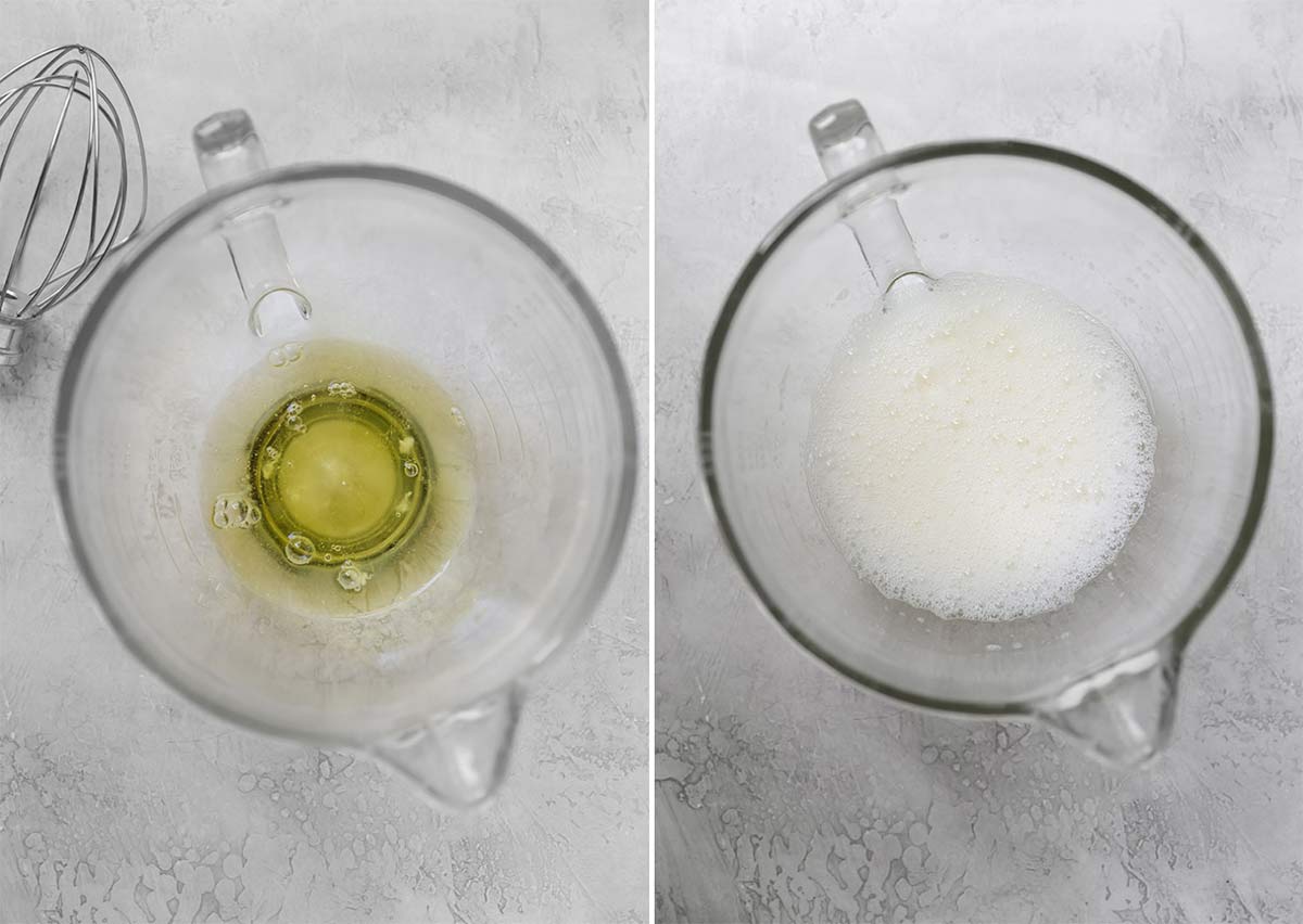 Egg whites in a glass mixing bowl whipped to frothy.