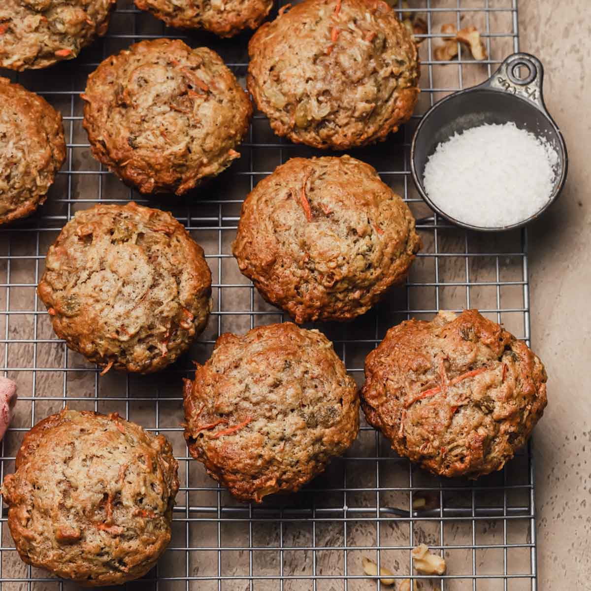 Morning glory muffins on a wire cooling rack.