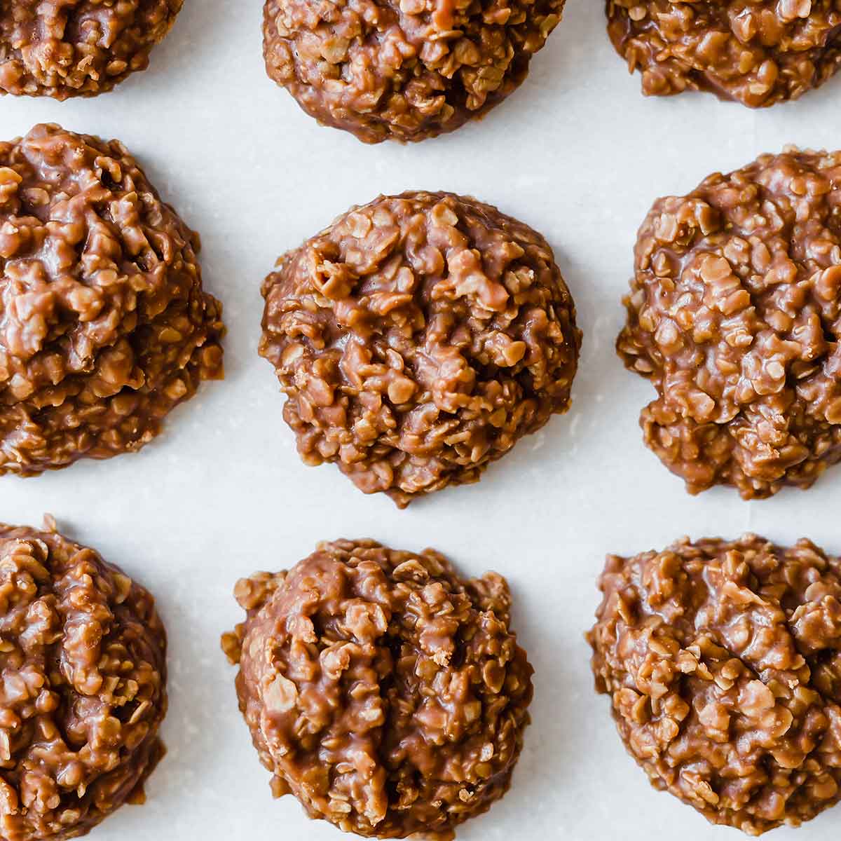 An overhead photo of no bake cookies on parchment paper.