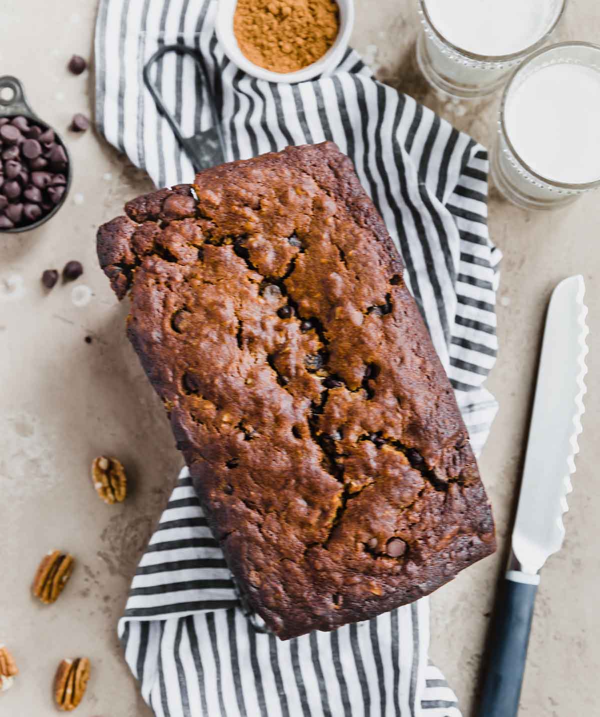 Overhead photo of loaf of pumpkin bread with chocolate chips.