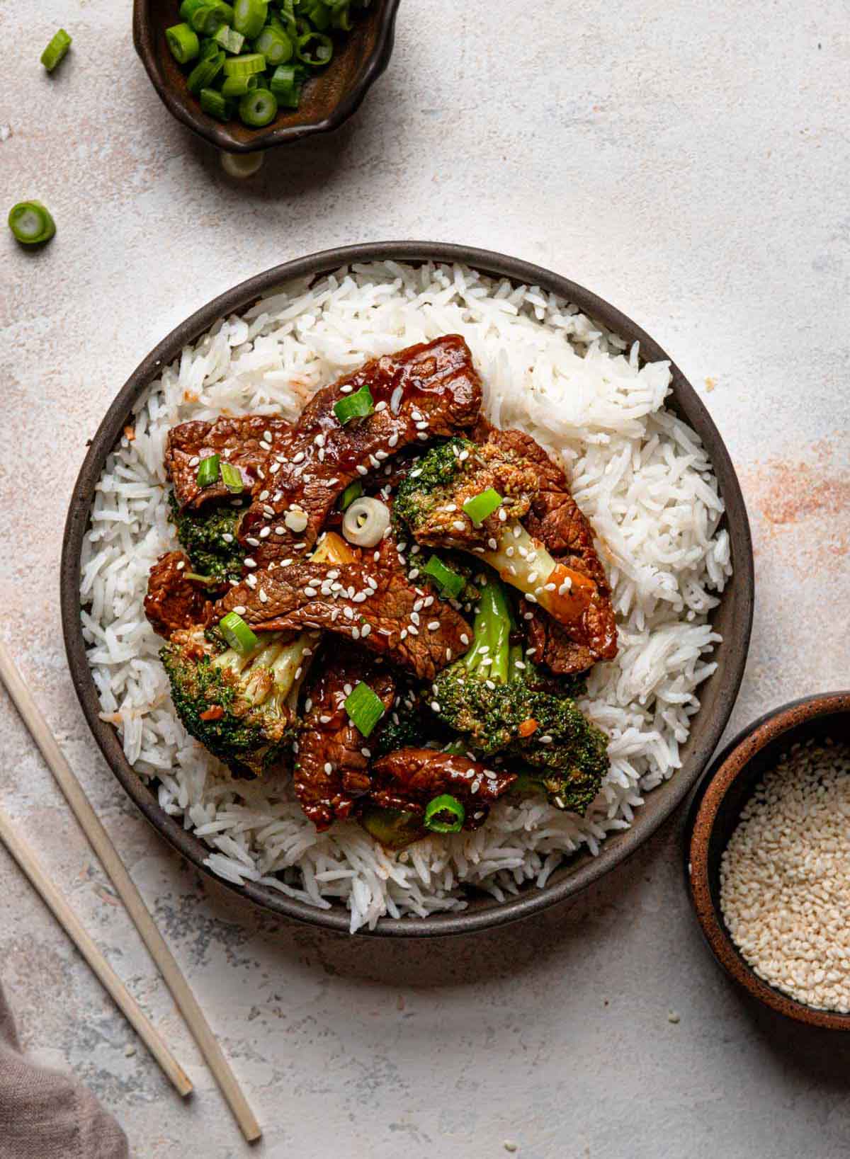Overhead photo of beef and broccoli stir fry over white rice.
