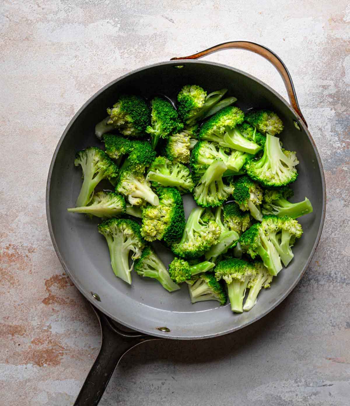 Overhead photo of pan with broccoli florets.