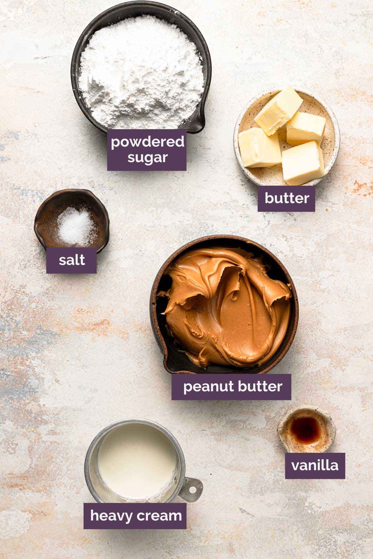 Ingredients for peanut butter frosting prepped in bowls and labeled.